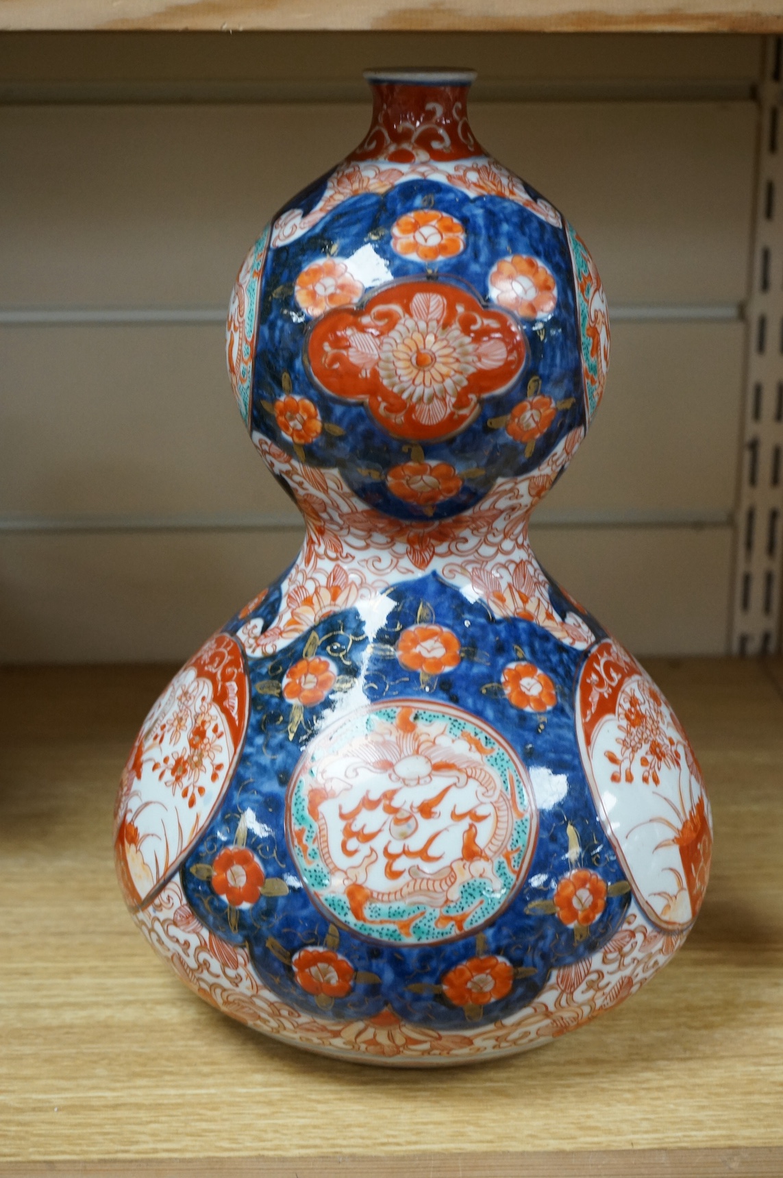 A Japanese Imari double-gourd vase, 31cm high. Condition - good, a little worn
